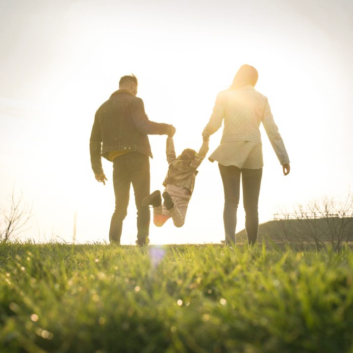 Happy family heaving fun in the park.
