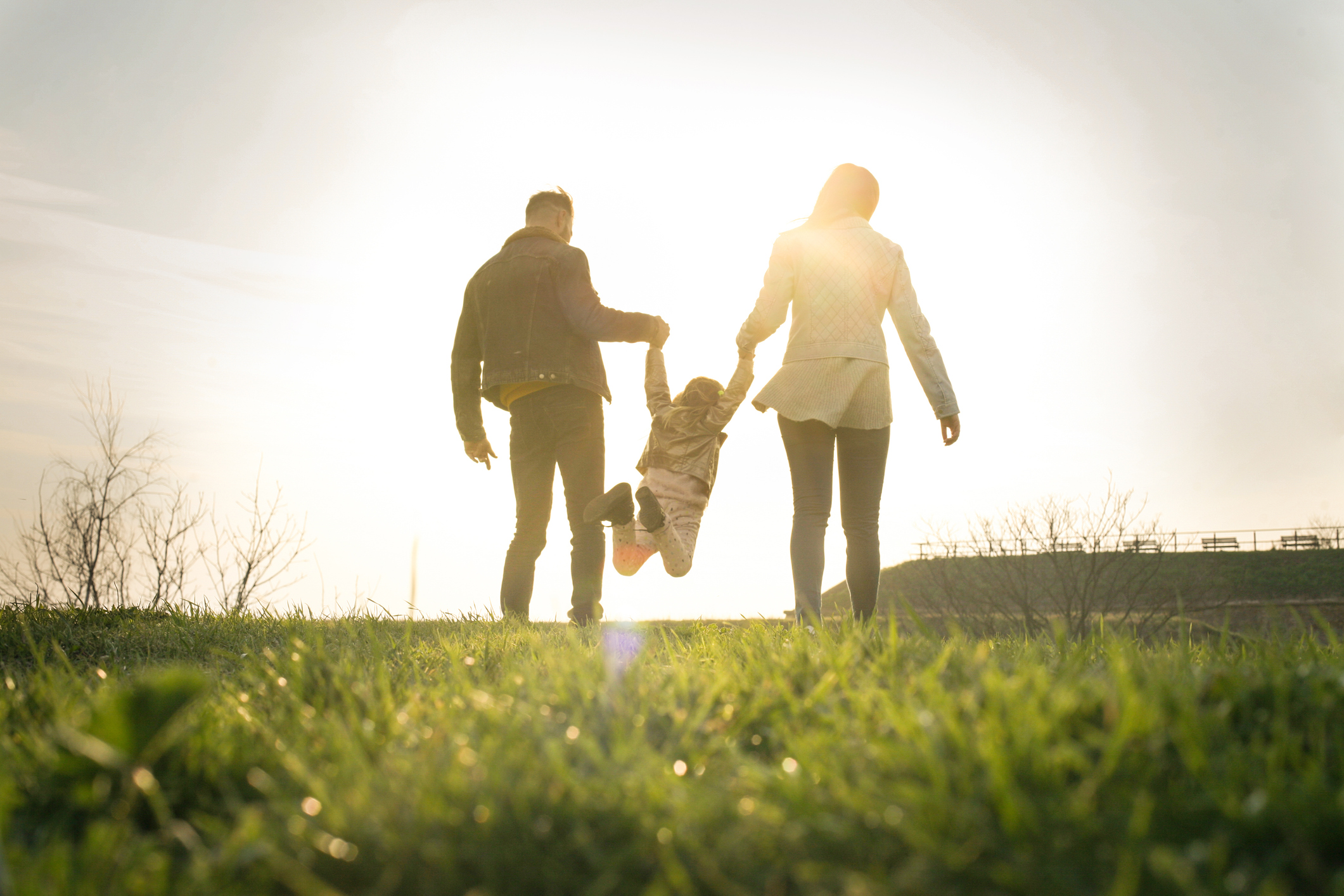 Happy family heaving fun in the park.